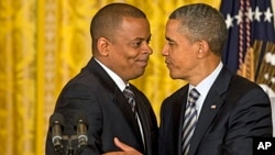 President Barack Obama (r) and Anthony Foxx, nominated as transportation secretary succeeding Ray LaHood, April 29, 2013.
