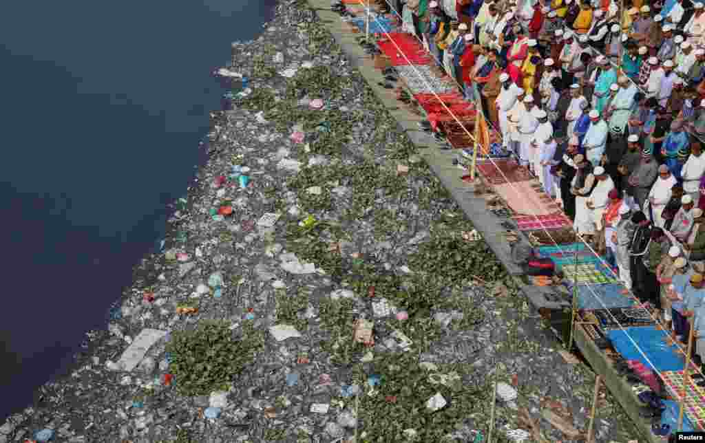Muslims from around the world perform Friday prayer on a makeshift bridge during Bishwa Ijtema, which is considered the world's second-largest Muslim gathering after haj, in Tongi, on the outskirts of Dhaka, Bangladesh.