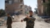 A Kurdish fighter from the People's Protection Units (YPG) is shown in Raqqa, Syria, June 27, 2017. 