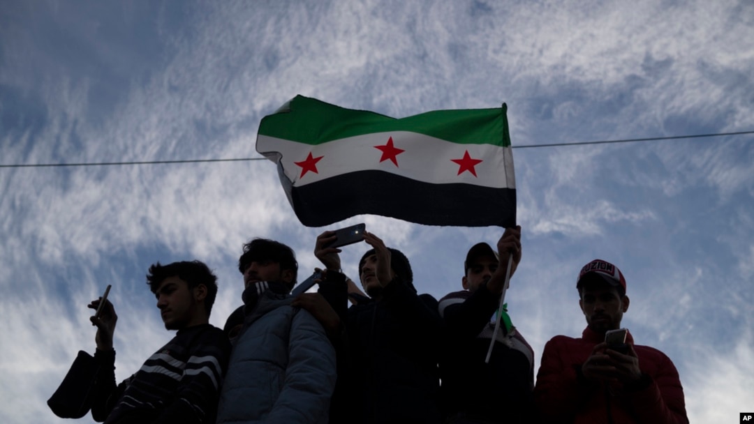 Syrians gather in celebration days after the fall of Bashar al-Assad's government at Umayyad Square in Damascus, Dec. 12, 2024. 