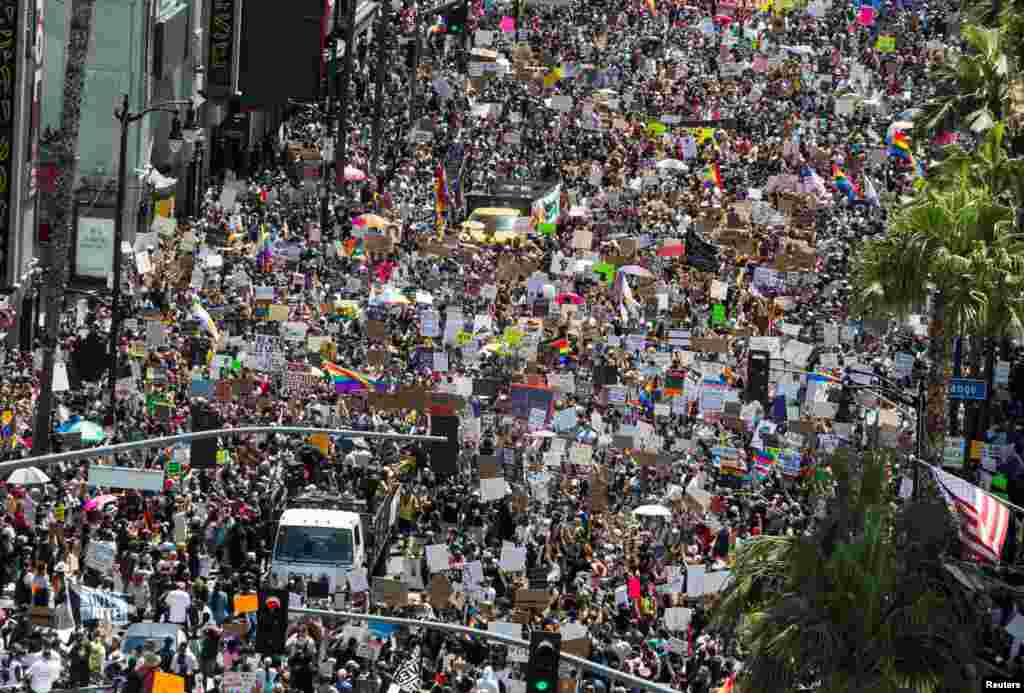 People take part in an All Black Lives Matter march, organized by Black LGBTQ+ leaders, in the aftermath of the death in Minneapolis police custody of George Floyd, in Hollywood, Los Angeles, California, June 14, 2020.