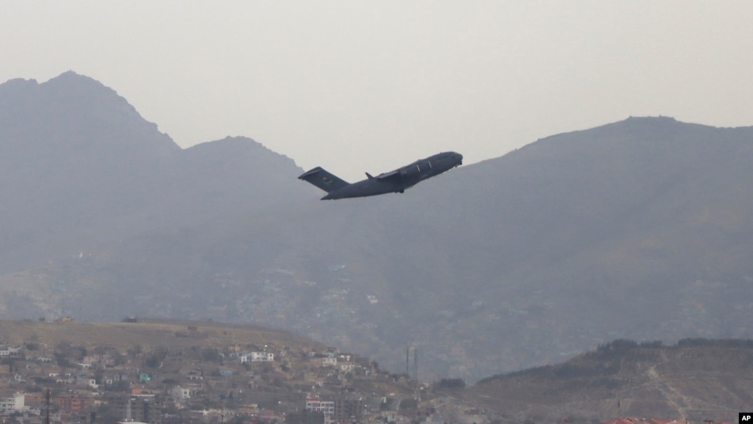 A U.S military aircraft takes off from the Hamid Karzai International Airport in Kabul, Afghanistan, Monday, Aug. 30, 2021. (AP Photo/Wali Sabawoon)