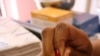 Blood is taken from Marais' finger in order to be tested for the presence of HIV
