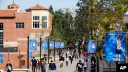 FILE - This Feb. 26, 2015 file photo shows students on the University of California, Los Angeles campus. A quarantine order was issued April 25, 2019, for hundreds of students and staff at two Los Angeles universities who may have been exposed to measles.