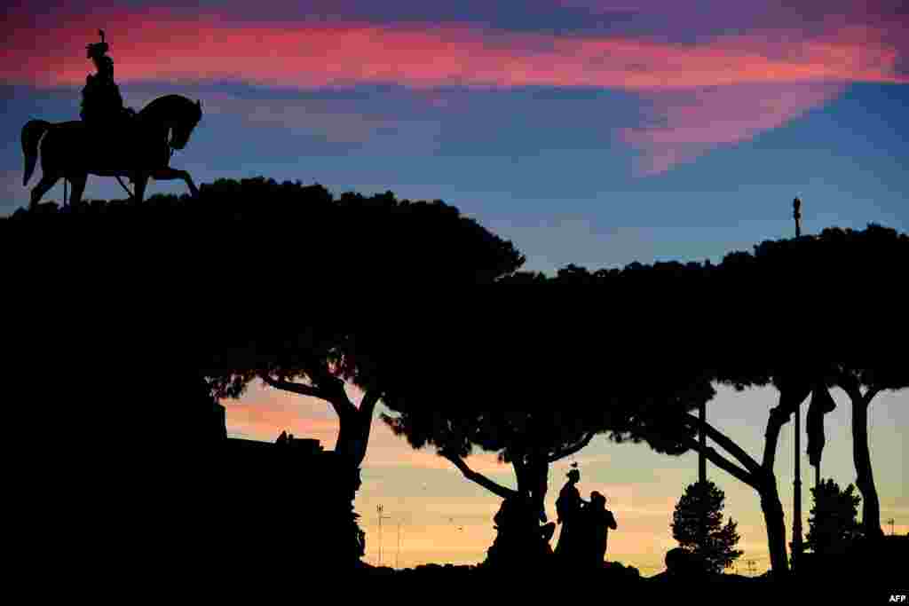 The Altare della Patria monument is seen at sunset in Rome, Italy.