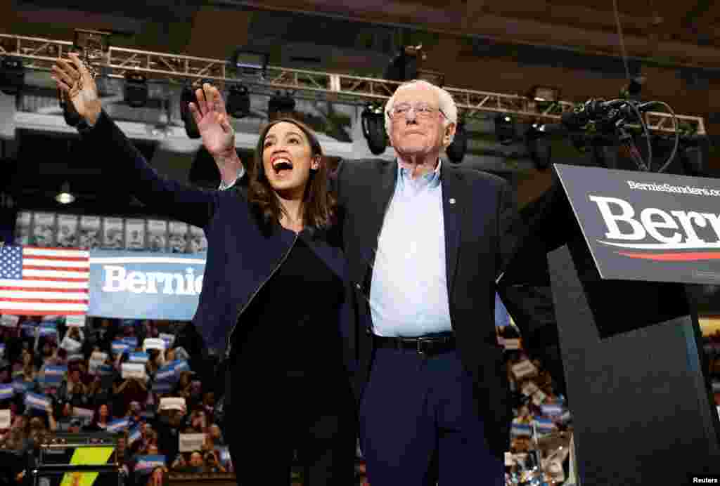 Democratic U.S. presidential candidate Senator Bernie Sanders takes the stage with Representative Alexandria Ocasio Cortez (D-NY) at a campaign rally and concert at the University of New Hampshire one day before the primary election in Durham, New Hampshire, Feb. 10, 2020.
