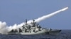  A Chinese warship launches a missile during a live-ammunition military drill held last year in the South China Sea. 