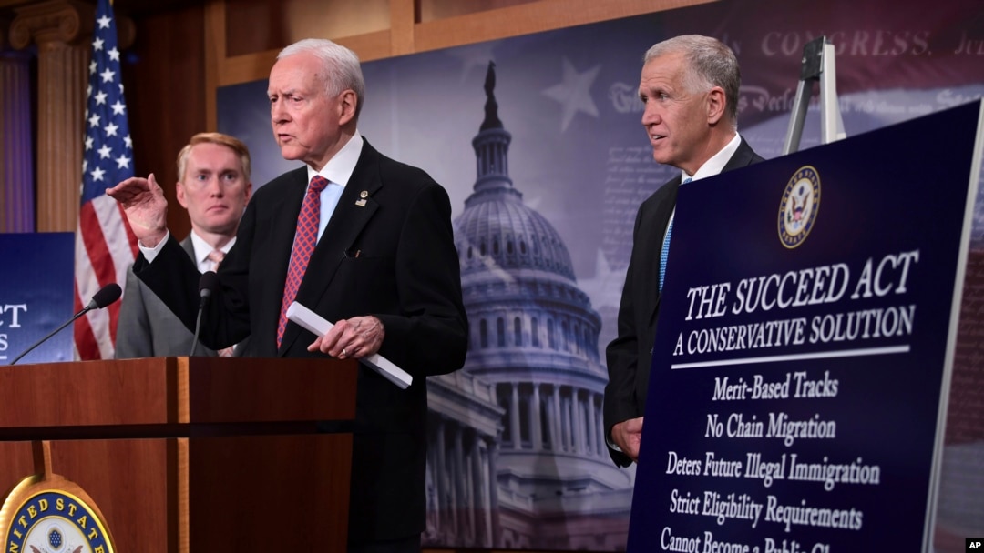 Sen. Orrin Hatch, R-Utah, center, flanked by Sen. James Lankford, R-Okla., left, and Sen. Thom Tillis, R-N.C., talk about the legislation they are introducing regarding the legal status of undocumented children during a news conference on Capitol Hill in Washington, Sept. 25, 2017. 