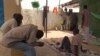 FILE - Former Boko Haram fighters gather in of one of the buildings of the transitional camp in Diffa, Niger, April 17, 2017.