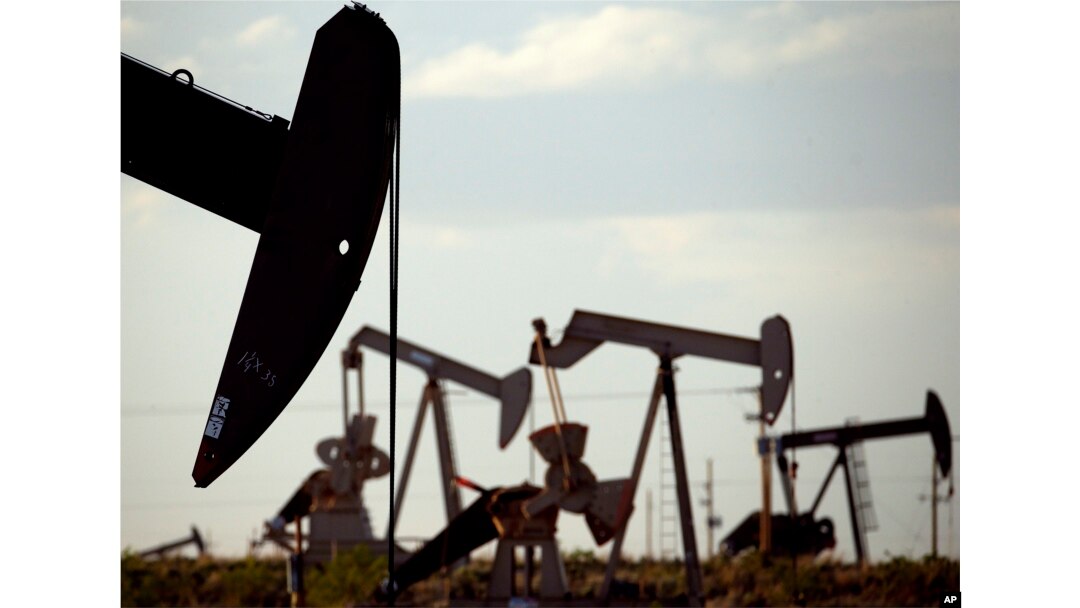 FILE - In this April 24, 2015, photo, pumpjacks work in a field near Lovington, N.M. Some studies show that the production of natural gas from the earth releases methane gas into the atmosphere. (AP Photo/Charlie Riedel, File)