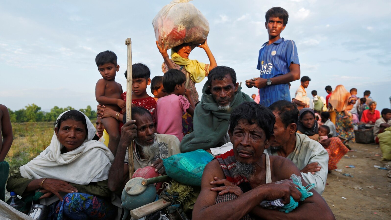 Exhausted Rohingya refugees wait to be taken to a refugee camp after crossing the Naf river at the Bangladesh-Myanmar border in Palang Khali, near Cox’s Bazar, Bangladesh, Nov. 2, 2017.