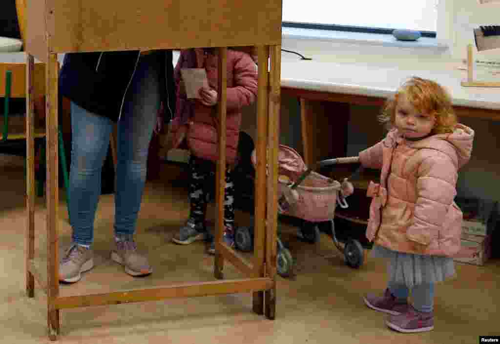 A young girl is seen at a polling station in Inisheer (Inis Oirr), ahead of Ireland's national election, Ireland.