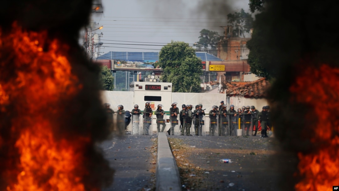 Bolivarian National Guard troops man a barricade blocking access to the Francisco De Paula Santander international bridge in Urena, Venezuela, on the border with Colombia, Feb. 23, 2019.