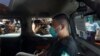 FILE - Tong Ying-kit arrives at a court in a police van in Hong Kong, July 6, 2020. Tong, the first person to be tried under Hong Kong's sweeping national security law was found guilty of secessionism and terrorism, July 27, 2021.