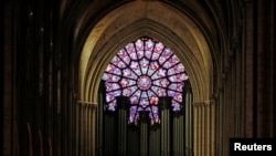 FILE -- A view shows the organ and a rose window inside the Notre Dame Cathedral in Paris, France, August 28, 2017.