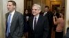 FILE - US. Supreme Court nominee Judge Merrick Garland (R) walks after a breakfast with Senate Judiciary Committee Chair Senator Chuck Grassley (R-IA) on Capitol Hill Washington, April 12, 2016. 