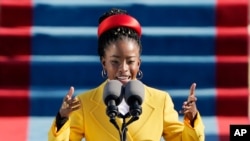 FILE - American poet Amanda Gorman reads a poem during the inauguration of President Joe Biden at the U.S. Capitol in Washington, Jan. 20, 2021.