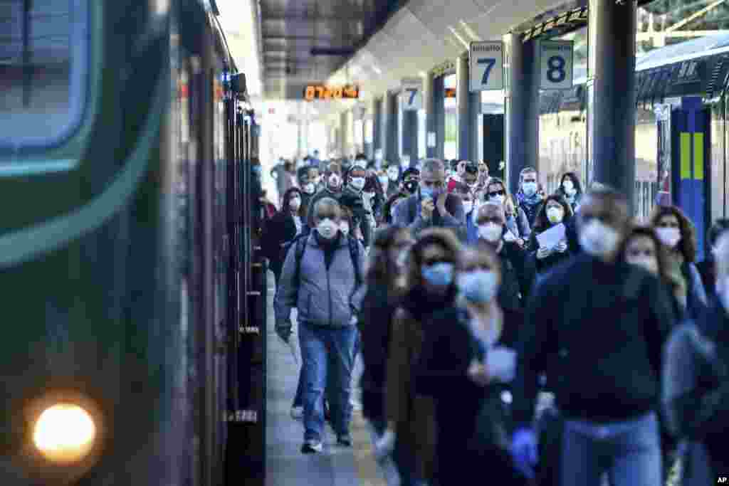 Commuters crowd Cadorna train station in Milan, Italy. Italians returned to work and restrictions on movement eased after a two-month coronavirus shutdown.