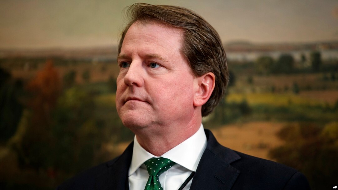 FILE - White House counsel Don McGahn waits for the arrival of President Donald Trump in the Roosevelt Room of the White House, May 24, 2018, in Washington.