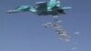 FILE - A still image, taken from video footage and released by Russia's Defense Ministry on Aug. 18, 2016, shows a Russian Sukhoi Su-34 fighter-bomber dropping bombs in the Syrian province of Deir ez-Zor. 