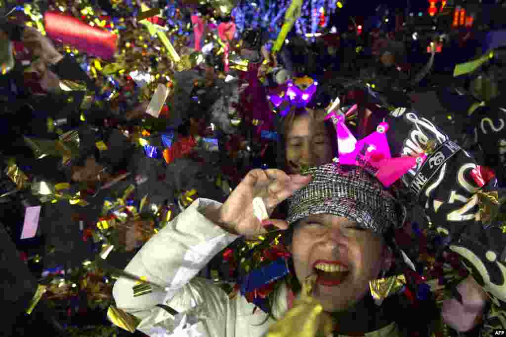 People celebrate the arrival of the year 2020 at a New Year's Eve countdown event near the 2022 Beijing Winter Olympic headquarters in Bejing, China.