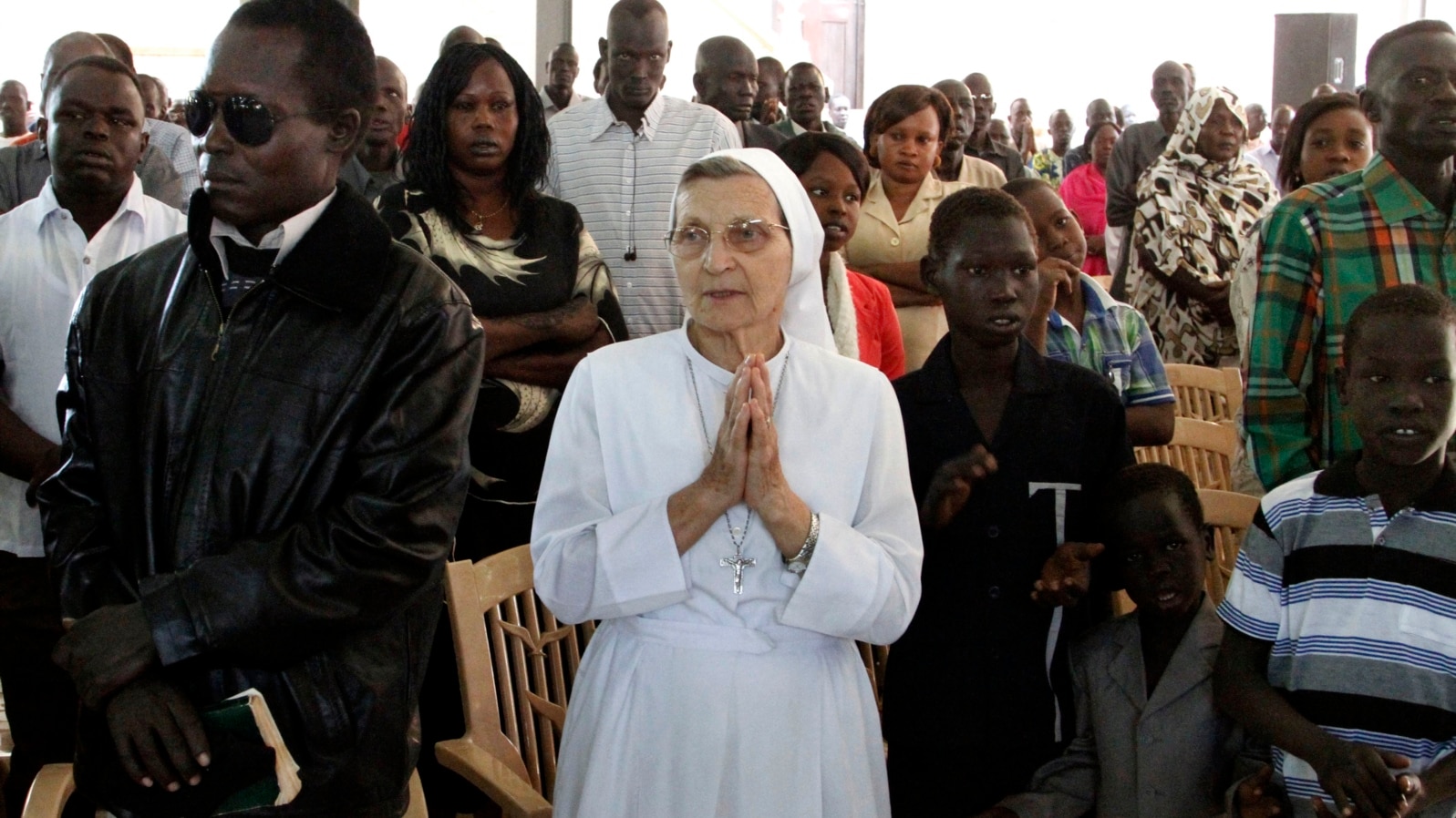 Christian worshippers pray during Christmas mass at a Church in Khartoum, Sudan, Dec. 25, 2013. 