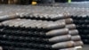 FILE - 155 mm M795 artillery projectiles are stacked during manufacturing process at the Scranton Army Ammunition Plant in Scranton, Pa., Thursday, April 13, 2023. 