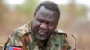 South Sudan's rebel leader Riek Machar speaks to rebel General Peter Gatdet Yaka (not seen) in a rebel controlled territory in Jonglei State, Feb. 1, 2014. 