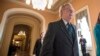 Senate Majority Leader Mitch McConnell walks to the chamber where he offered a tribute to the late Supreme Court Justice Antonin Scalia, on Capitol Hill in Washington, Feb. 22, 2016.
