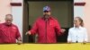 FILE - Venezuelan President Nicolas Maduro speaks to supporters, alongside Interior Minister Diosdado Cabello and first lady Cilia Flores at an event marking the anniversary of the 1958 coup that overthrew dictator Marcos Perez Jimenez, in Caracas on Jan 23, 2025.