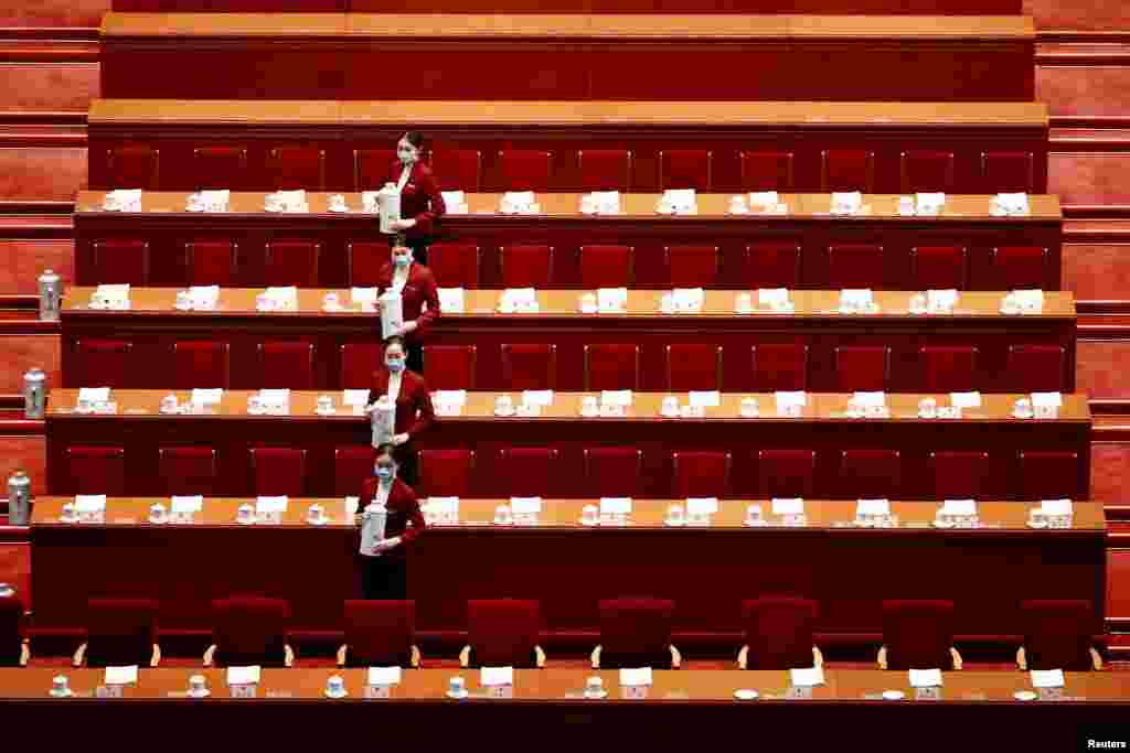 Attendants wearing face masks are seen before the second plenary session of the National People's Congress at the Great Hall of the People in Beijing, China.