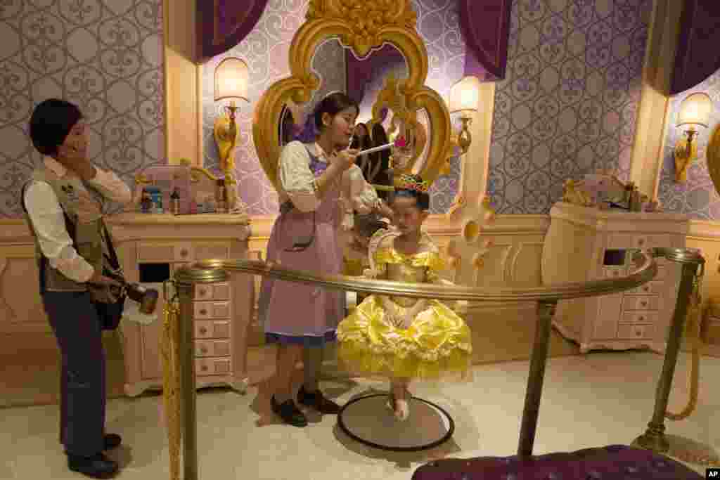 A Chinese girl gets a Princess makeover at the Disney Resort in Shanghai, China. The debut of Shanghai Disneyland offers Walt Disney Co. "incredible potential" for boosting its brand in the world's most populous market, Disney's chief executive said Wednesday ahead of Thursday's grand opening for the $5.5 billion park.
