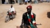 An SPLA soldier drives in a vehicle in Juba December 21, 2013. Troops were deployed around the city again in March after clashes at an army barracks claimed the lives of at least 24 soldiers. 