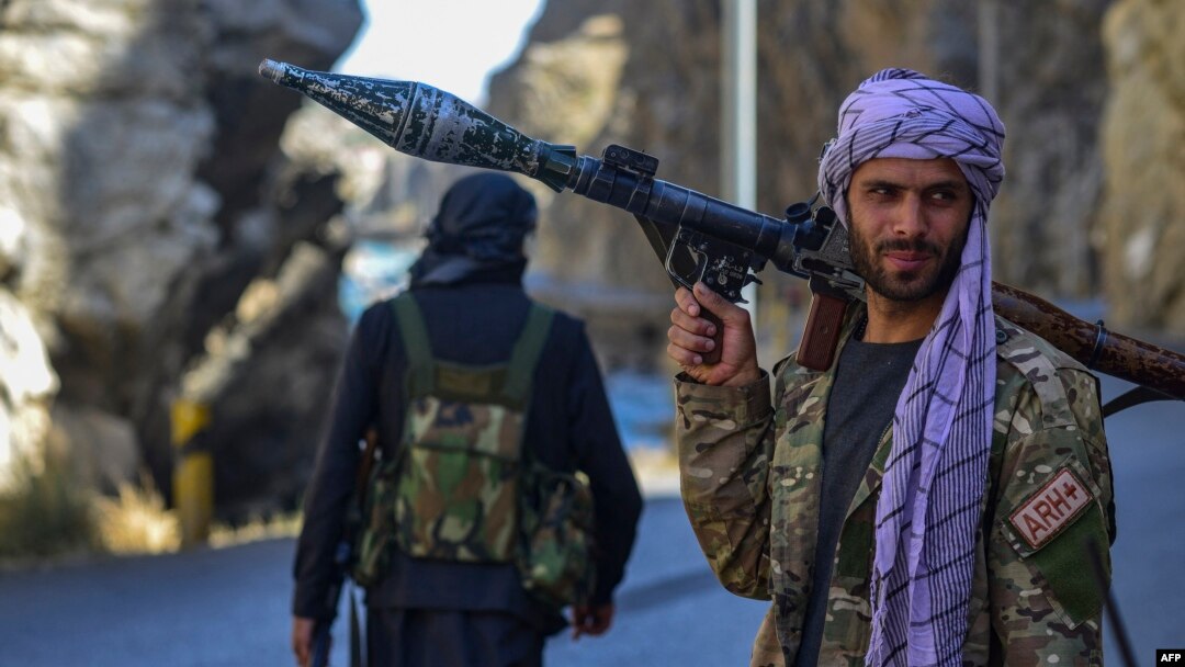 Afghan resistance movement and anti-Taliban uprising forces patrol along a road at the Rah-e Tang in Panjshir province on August 25, 2021 following Taliban's military takeover of Afghanistan. (Photo by Ahmad SAHEL ARMAN / AFP)