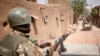 FILE - Troops of the Malian army patrol the ancient town of Djenne in central Mali, Feb. 28, 2020. 