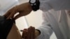 FILE - A doctor injects vaccine into a patient's arm, in Rome, Italy, Feb. 23, 2018.