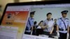 A photo described as the trial showing human rights lawyer Xie Yang which is seen on the social media of the Changshai Intermediate People's Court is displayed on a computer in Beijing, May 8, 2017.