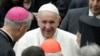 Pope Francis talks to prelates during an audience with participants of a pilgrimage of the Italian-Albanian diocese of Lungro, in the Pope Paul VI hall at the Vatican, May 25, 2019.