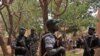 Malian soldiers mill around inside the milirary camp of Malian junta leader Amadou Sanogo in Kati near Bamako on March 30, 2012.