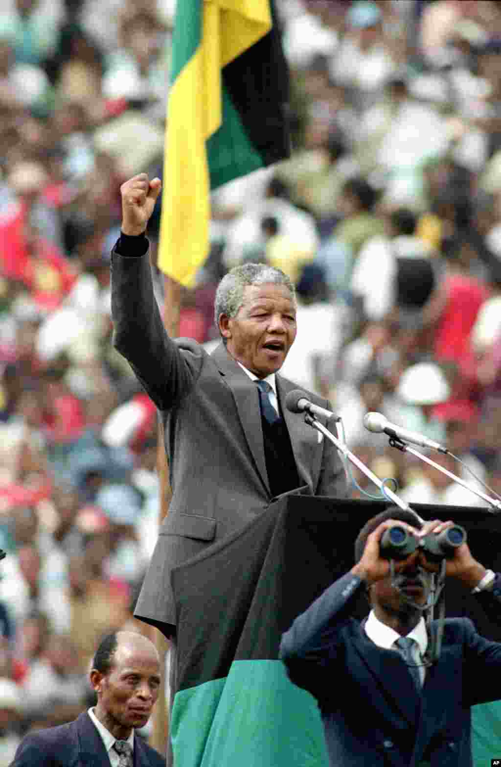 ANC leader and symbol of resistance to apartheid, Nelson Mandela, is seen as he gives the black power salute to the 120,000 ANC supporters in Soweto's Soccer City stadium in Soweto, near Johannesburg, South Africa, Feb. 13, 1990.