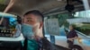 FILE - In this July 6, 2020, photo, Tong Ying-kit arrives at a court in a police van in Hong Kong.