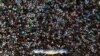 Crowds throng a religious festival in Nakhon Pathom province, Thailand, on March 23, 2024. Thailand's low birth rate could mean the population will shrink by half within 60 years.