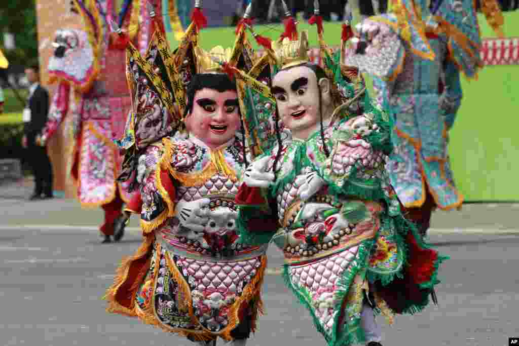 Dancers dressed as Chinese gods perform during the inauguration ceremony of Taiwan's President Tsai Ing-wen in Taipei.