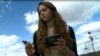 Distracted walking has become a global problem, especially with the rising use of cell phones and other hand-held devices. (VOA/A. Greenbaum) 