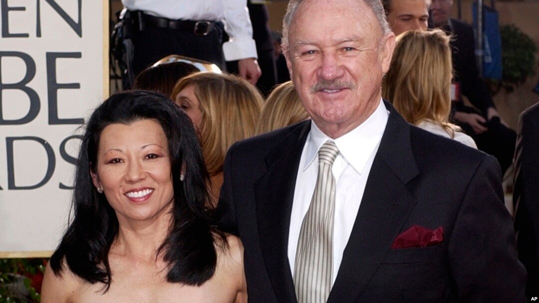 FILE - Actor Gene Hackman arrives with his wife, Betsy Arakawa, for the 60th Annual Golden Globe Awards in Beverly Hills, California, Jan. 19, 2003.