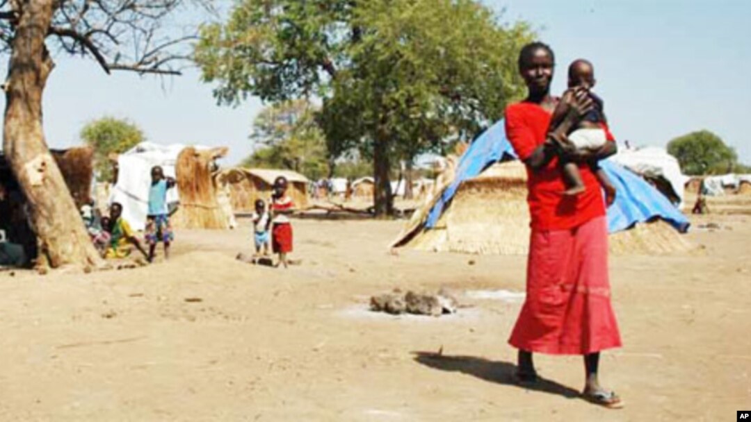 Darfur's displaced set up huts near and old airstrip in the village of Jaac in southern Sudan.