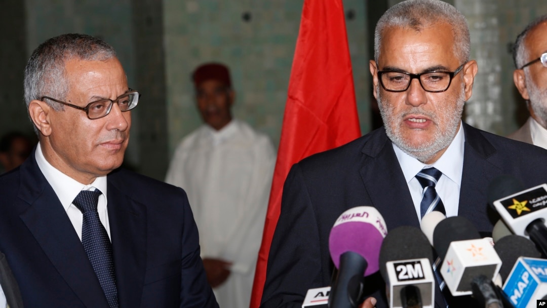 Morocco's Prime Minister Abdelilah Benkirane (R) and his Libyan counterpart Ali Zeidan speak to the media during a press conference in Rabat, Morocco, Oct. 8, 2013.