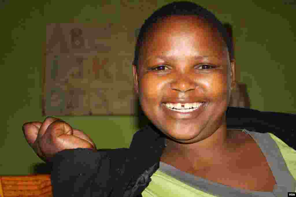 Lumka Zenani is paralyzed and has cerebral palsy, but is always joyful and exuberant. (VOA/ D. Taylor)