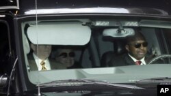 Secretary of State Hillary Clinton, center, is transported from the New York Presbyterian Hospital complex Wednesday, Jan. 2, 2013. 