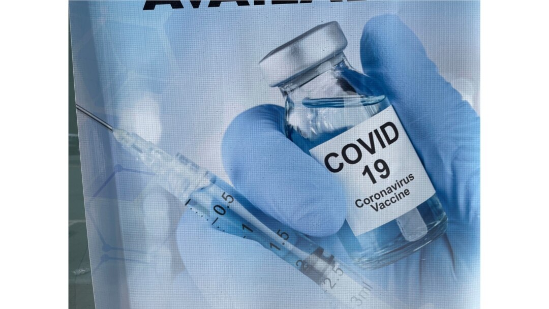 A sign for a COVID-19 vaccine is seen in White Plains, N.Y. Johnson & Johnson said Aug. 25, 2021, that a booster shot for its vaccine after six months may have big benefits.